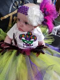 Lillian won her Mardi Gras pageant today!!!! I really wanted to share the  beautiful onesie we recieved from Crystal! It went so beautifully with the  tutu and headdress I made. Everyone loved