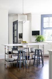 Stainless Steel And Brass Legs On French Island Transitional Kitchen