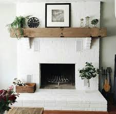 Brick Fireplace Painted White With A Cedar Mantle White Brick Fireplace Brick Fireplace Mantles Brick Fireplace Makeover