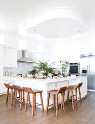 You can design seating on the outside to create that social element, as well as gain more prep space by having a deeper. Stools On Two Sides Of Island Design Ideas