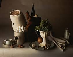 This is more about using the dark colours of the food and its background and surroundings in combination with natural window lighting such as in the example below. The Irving Penn Foundation