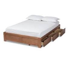 The practical design of this platform storage bed combines extra deep drawers for plenty of storage space with a wood slat support system intended to distribute body weight evenly and minimize the amount of motion transfer. Baxton Studio Wren Walnut King Platform Storage Bed Frame 158 9622 Hd The Home Depot Bed Frame With Storage Bed Frame With Drawers Storage Bed