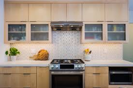 Kitchen With Maple Slab Door Cabinetry With Diamond Patterned Backsplash Slab Door Maple Cabinets Residential Remodel