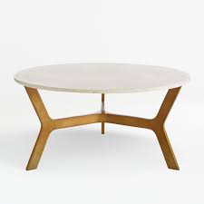 Providing a solid focal point in any living room, coffee tables act as spots to set down refreshments, collect remote controls and display artsy collections of coffee table books (or trashy magazines!). Elke Round Marble Coffee Table With Brass Base Reviews Crate And Barrel Canada