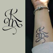 Mehndi letter km tattoo designs. Pin On M