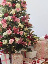 This Tree Is A Dramatic Showstopper With Pink Burgundy And Mauve Flowers In Its B Pink Christmas Tree Decorations Floral Christmas Tree Christmas Tree Flowers