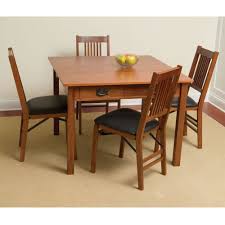 Mission style furniture beautifully combines form and function with exposed joinery, highlighting the durable amish craftsmanship while simultaneously creating an effective style element. The Mission Style Console To Card To Dinner Table Hammacher Schlemmer
