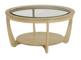 A coffee table might be as much as 21 inches in height or length, or it may appear oversized if the table is an odd shape or a custom piece. Nathan Shades Oak Glass Top Round Coffee Table Coffee Tables Hafren Furnishers