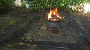 If you are building your stone fire pit on top of an existing backyard patio. The Just Completed Fire Pit Using An Old Truck Rim Used For Burning Of All The Twiggy Sticks From The Garden Fire Pit Uses Wheel Fire Pit Fire Pit