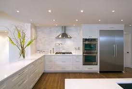 Caesarstone Organic White Kitchen Transitional With Wood Floor White Standard Height Dining Tables Kitchen Cabinet Sizes White Marble Kitchen White Kitchen