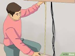 To do this you'll need to cut two holes in the drywall with a drywall saw, drill, or. 3 Ways To Hide Cables On The Wall Wikihow