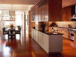 Kitchen with chevron backsplash and lots of gray has a brown floor? Galley Style Kitchen With Adjacent Dining Room Galley Style Kitchen Kitchen Styling Kitchen Remodel