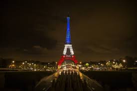 Also known as the iron woman, eiffel tower is an iconic symbol of the city of lights. Photos Eiffel Tower In The French Flag S Colors Los Angeles Times