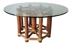 Elegant midcentury dining table features a sculptural hourglass rattan base with a round glass top. Vintage Mcguire Bamboo And Glass Top Round Dining Table Chairish