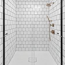 This elegant bathroom features white tile flooring with black caulking. White Shower Tiles With Black Grout Design Ideas