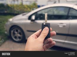 As far as we know, the basic cost for a service call with an automotive locksmith will be around $15. Man Holds Auto Key Image Photo Free Trial Bigstock