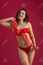 Maybe you would like to learn more about one of these? Sexy Smiling Girl Wrapped In Red Satin Ribbon With Bow Posing Stock Photo Picture And Royalty Free Image Image 139337477