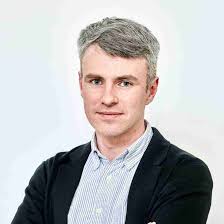 Genome-wide association study of musical beat synchronization demonstrates  high polygenicity