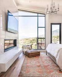 Floor To Ceiling Windows Marble Fireplace And Transitional Chandelier Bedroom Master B Floor To Ceiling Windows Marble Fireplaces Master Bedroom Bathroom