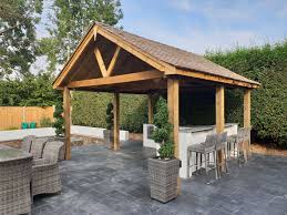 Summer is the time for backyard bbq's and grilling; Outdoor Kitchen With Seating And Shelter Outdoor Cooking Area Outdoor Cooking Spaces Barbeque Garden Design