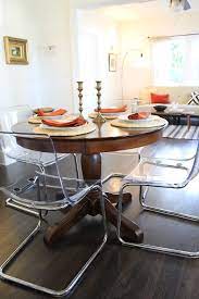 Explore the latest designer dining tables at neiman marcus! Clear Acrylic Dining Chairs Paired With Traditional Pedestal Table Eclectic Dining Room Los Angeles By Madison Modern Home Houzz