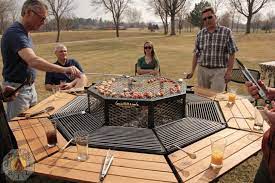 The building materials used in this outdoor space keep a natural and earthy feel: Your New Favorite Grill Triples As A Picnic Table And Fire Pit Reviewed