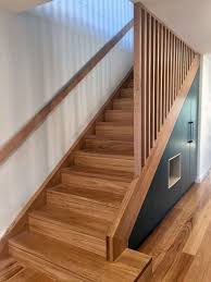 This rail installs using common handrail brackets mounted to the studs in stair well walls. Blackbutt Staircase With Matching Handrail And Timber Battens Under Stair Storage Cabinetry Romandini Basement Staircase Stair Railing Design Timber Battens