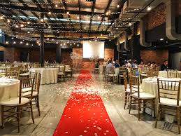 Raw bricks, glass ceilings, exposed concrete provide the charms of rustic minimalism with an homage to industrial influence. T6 Light Grey Rooftop Event Space Vmo