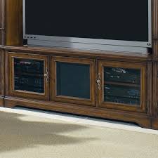The desk has a wide retractable shelf behind a drop down door. Hooker Furniture Brookhaven Three Door Tv Console Stoney Creek Furniture Tv Stands