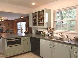 Flat surfaces and space to dry a flat painting surface is the key to refinishing kitchen cabinets. How To Paint Old Kitchen Cabinets How Tos Diy