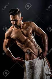 Handsome Young Strong Man. Stripped Guy With White Towel On Dark  Background. Naked Bodybuilder With Towel. Фотография, картинки, изображения  и сток-фотография без роялти. Image 138631228