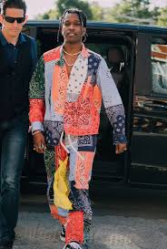 In asap rocky's recent instagram post, he's photographed dressing down a loverboy slash stripe jumper with a pair of custom torn jeans and some red flame vans old skool sneakers. Asap Rocky Fashion The Best Outfits Of All Time Complex