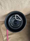 What does 1:4-5.6, IS, and STM mean on a camera lens?