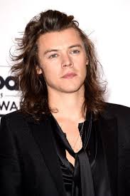 Youthful and pretty well tamed. A Look At Approximately How Many Inches Harry Styles Hair Grew In 2015