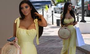 Chloe Khan puts on an eye-popping display in busty pastel yellow jumpsuit |  Daily Mail Online