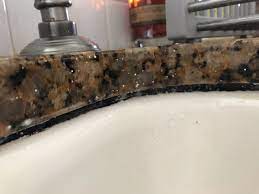 Undermount sinks do have a rim. Clean Undermount Sink Caulk Replacing It Is Faster Askthebuilder Com