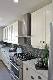 Subway tile backsplash stainless steel stockpots kitchen contemporary and wood floor beveled tiles. 21 Best Grey Backsplash Ideas In 2021 Kitchen Remodel Kitchen Design Kitchen Renovation