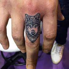 101 Best Wolf Tattoos For Men Cool Designs Ideas 2021 Guide Small Wolf Tattoo Finger Tattoos Sleeve Tattoos