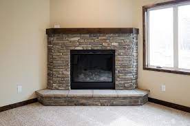 Corner Fireplace With Bucks County Ledgestone Alder Cap And Raised Stone Hearth Fireplace Tile Farmhouse Fireplace Cottage Fireplace