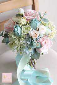Maybe you would like to learn more about one of these? Bridal Bouquet In Tiffany Blue Roses Hydrangea Ranunculus Tiffany Blue Wedding Tiffany Blue Weddings Wedding Floral Centerpieces