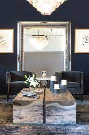 Whether it's a martini or a mug of coffee, the space in the middle of your living room, that place where couch, chair, and tv converge, needs to have a surface that can hold a drink or two. Living Room With Two Coffee Tables Transitional Living Room