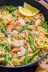 Shrimp Scampi Pasta With Asparagus Has A Lemon Garlic And Herb Sauce That Packs So Much Fresh And Ama Scampi Pasta Asparagus Recipe Shrimp Scampi Pasta Recipes