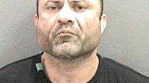 Martial arts fighter wearing police uniform held