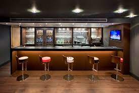 This shaker style bar created using homecrest cabinetry and floating shelves. Bar Design Inside The House
