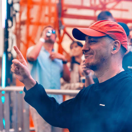 Dosem performing behind the decks