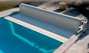 An exposed pool loses thousands of gallons of water a year to evaporation. Automatic Swimming Pool Cover Neptune Aqualux International Security Immersed
