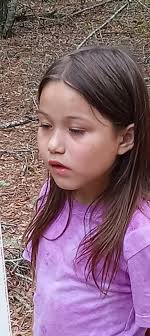 Little girl riding a horse at Cedar Creek Stables