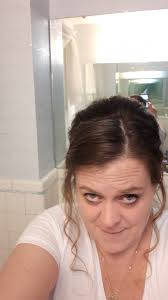 Lost black cat with purple and white collar near university