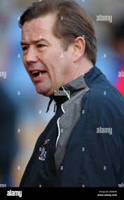 Coventry City Assistant Manager Adrian Viveash (left) talks to Marc McNulty  Stock Photo