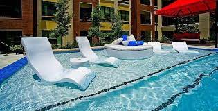 Tanning ledges are usually big enough for setting up a few lounge chairs or to accommodate numerous people. Tanning Ledge High Back Pool Chair Tanning Ledge Pool Pool Chairs Pool Lounge Chairs
